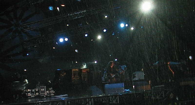 As the rain continues to pour down, The Cure play on.